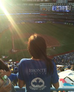 Summer camp student inside the SkyDome watching the Blue Jays play